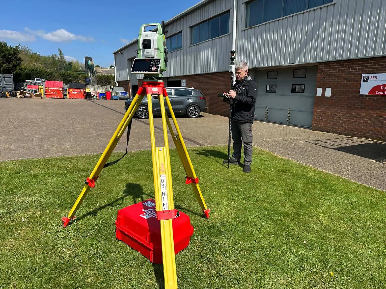 Robotic total station equipment set up for practical construction surveying training.
