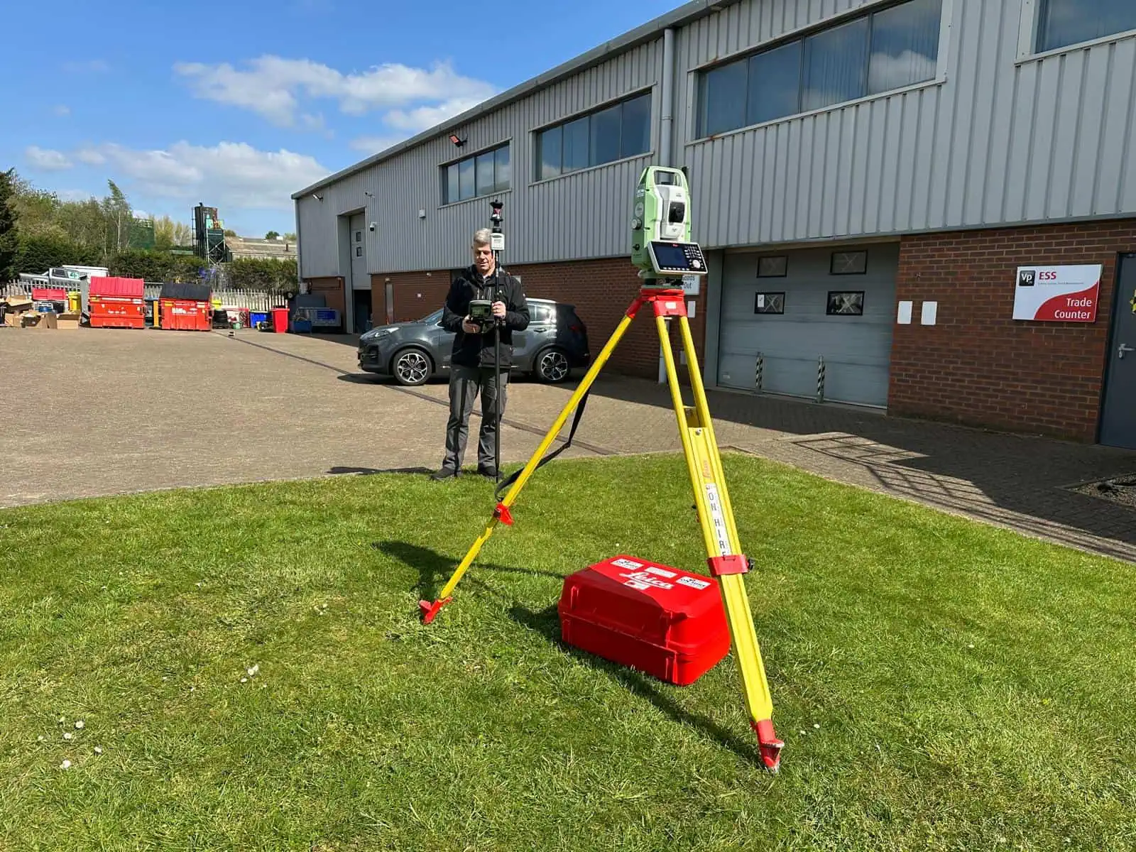 Robotic total station set up for setting out training outside a training centre.